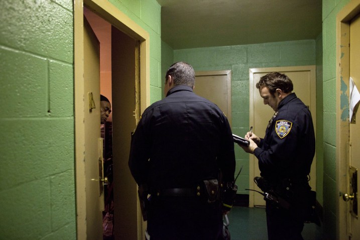 New York City police officers go door to door in a housing project to take note of which residents are ignoring the mandatory evacuation order as Hurricane Sandy approaches on October 28, 2012 in the Rockaway Beach neighborhood of the Queens borough of New York City. Photo: Allison Joyce, Getty Images